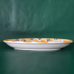 Piatto ovale con piume di pavone giallo