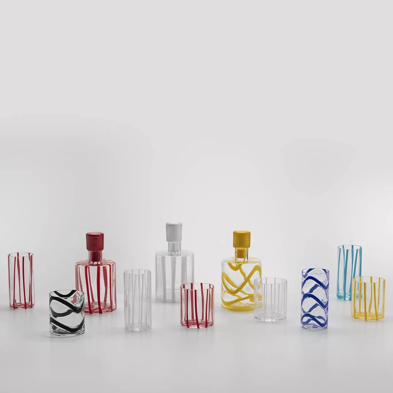 Set di 6 bicchieri highball Cyrcus in vetro di Murano rigato rosso e trasparente